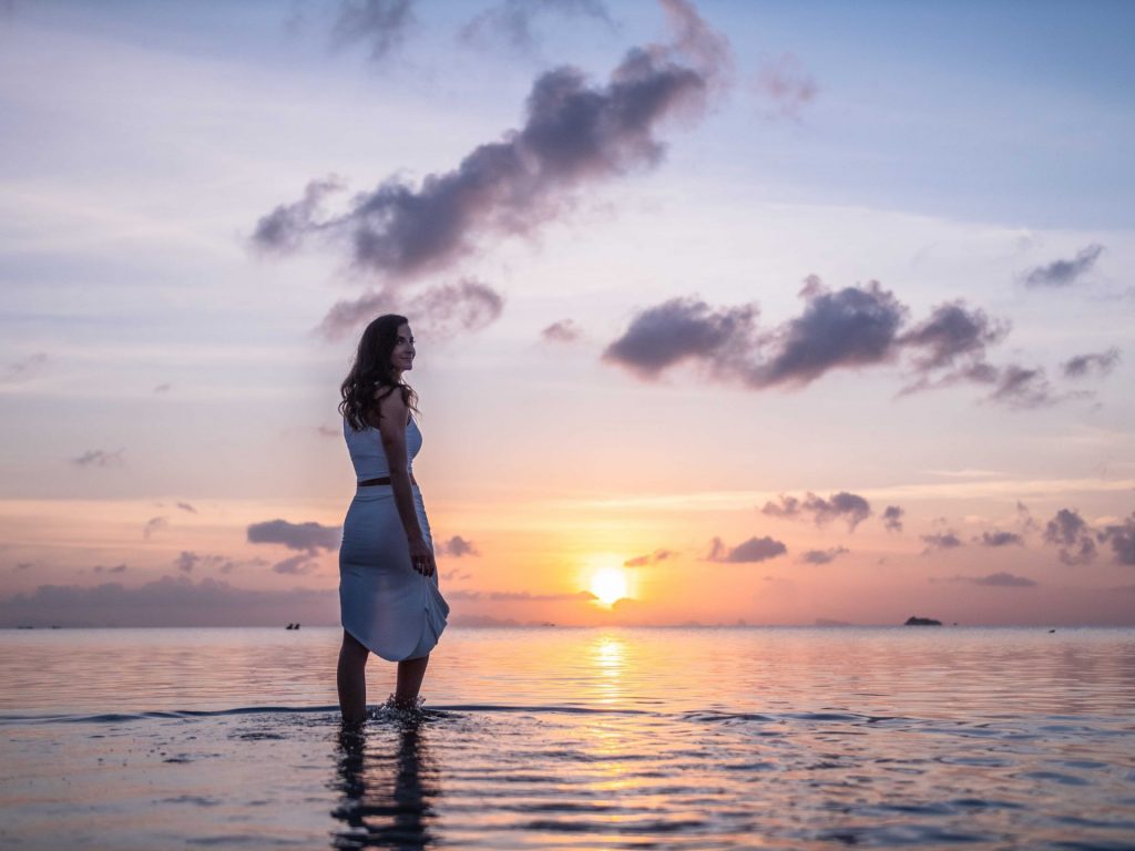 Woman smiling at sunset